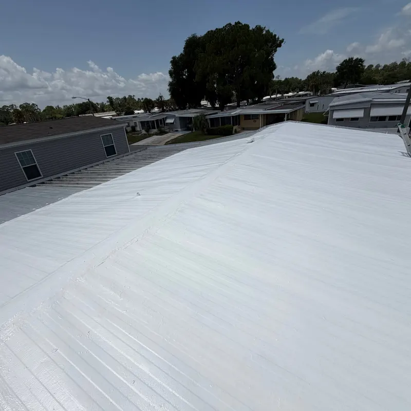 Mobile home metal roof with a finished white silicone coating