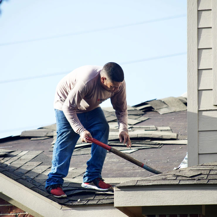men repairing roof